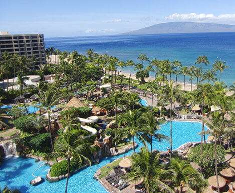 A resort on the coast with a lazy river and palm trees is an example of best places to stay in Maui, Hawaii